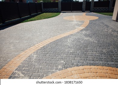 Stone pavement in perspective. Stone pavement texture. Granite cobblestoned pavement background. Abstract background of a cobblestone pavement