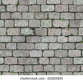 Stone Pavement Texture. Granite Cobblestoned Pavement Background. Abstract Background Of Old Cobblestone Pavement Close-up. Seamless Texture. Perfect Tiled On All Sides