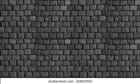 Stone Pavement Texture. Granite Cobblestoned Pavement Background. Abstract Background Of Old Cobble Stone Pavement Close-up. Seamless Texture. Perfect Tiled On All Sides