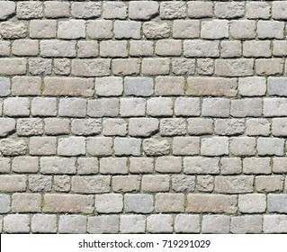 Stone pavement texture. Granite cobblestoned pavement background. Abstract background of old cobblestone pavement close-up. Seamless texture. Perfect tiled on all sides