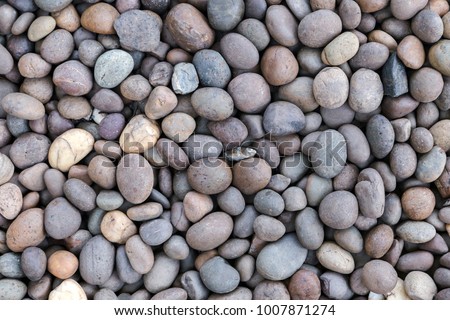 Stone pebbles texture background for interior exterior decoration and industrial construction concept design.