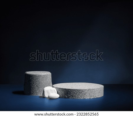Stone pedestal stage product display background on navy color.zen like backdrop