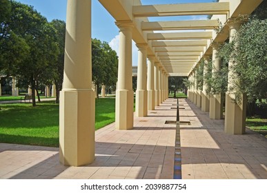 
stone pergola and floor with water features in a public park