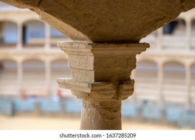 Stone Pillar In A Bullring With Tiered Seating In The Background