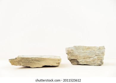 stone podium for displaying products on a pastel beige background. Ideal for product advertising. Copy space - Shutterstock ID 2011523612