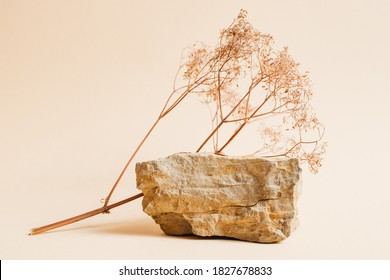 Stone podium with dried flowers for displaying products or cosmetics. Eco trends. Place for text - Shutterstock ID 1827678833