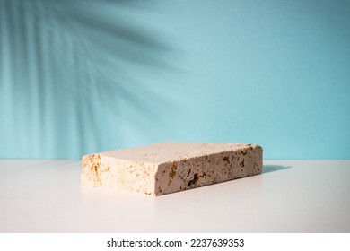 Stone podium for presentation cosmetic products. Palm leaves shadow. - Shutterstock ID 2237639353