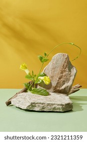 Stone podiums decorated with green leaves and yellow flowers. Blank space on the stone for product advertising - Shutterstock ID 2321211359