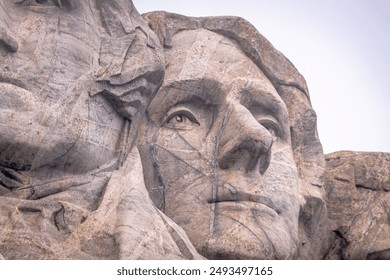 The stone profile of Thomas Jefferson at Mount Rushmore looks to the horizon - Powered by Shutterstock