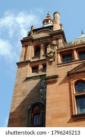 Stone Public Building With Cupola & Chimney Seen From Below Against Blue Sky 