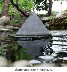 Stone pyramid in the pool