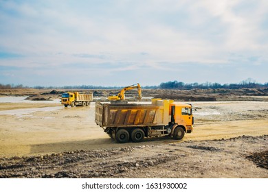 Stone Quarry In Russia, Loading A Stone With An Dredge, Loading Stone From A River Bed To Produce Crushed Stone, Digger Loads Stones Into A Truck, Dredge Digs A Ditch