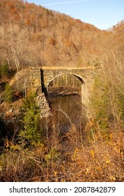 Stone Railroad bridge over the West Branch of the Westfield River, along the Keystone Arch Bridges Trail near Chester, Massachusetts, in late autumn.