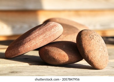 Stone rock close up on a wooden table. Selective focus. High quality photo - Shutterstock ID 2057847956
