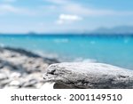 Stone rocky pedestal or podium in front of sea ocean background. Empty product template. Summer vibe. Mock-up. Stage for advertising