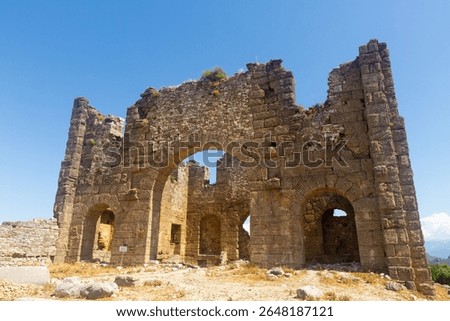 Stone ruins of eastern section of basilica in ancient Greco-Roman city of Aspendos in Antalya province. Archaeological and historical sights of Turkey