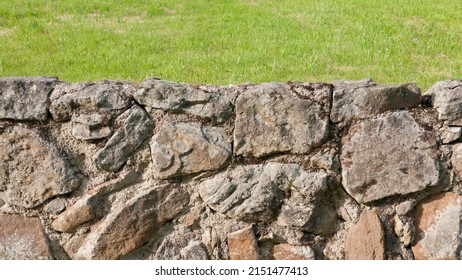 Stone Rustic Fence In A Farm