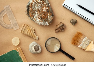 Stone samples, loop, notebook at geological laboratory. Geology rock laboratory. Laboratory for analysis of geological soil materials, stones, minerals, rocks samples for researchers- Brushing sample - Shutterstock ID 1721525350