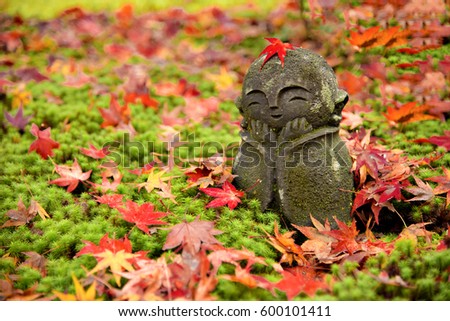 Stone sculpture dolls  and Maple Leaves at Momiji Autumn Leaves Festival at Enkoji Temple, Kyoto, Japan