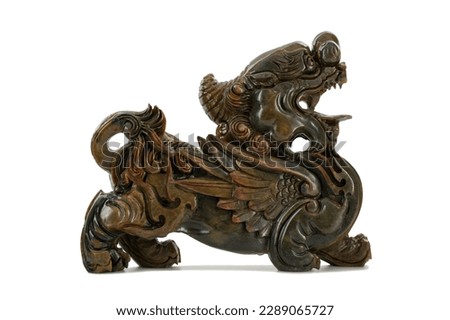 Stone sculpture of the Kylin dragon, a magical animal of Chinese mythology that brings good luck on a white background.