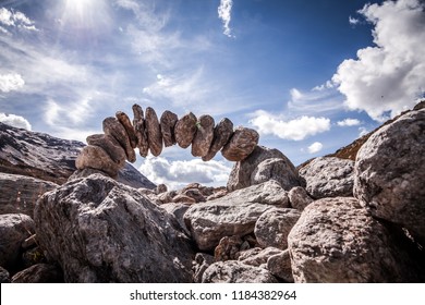 stone sculpture in the swiss alps. The theme is longevity, cohesion and trust. - Shutterstock ID 1184382964