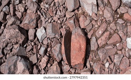 Stone split in half with a perfect straight cut from natural fracture.