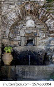 A Stone Springs On Mount Olympus (Greece, Regional Unit Pieria) Close-up With Cold, Useful, Clear Water In The Mountain Village On A Sunny Day.