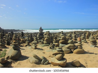 Stone stack arrangements made by visitors at the beach of Carrisbrook Creek which is along the route of the Great Ocean Road in Victoria, Australia.  