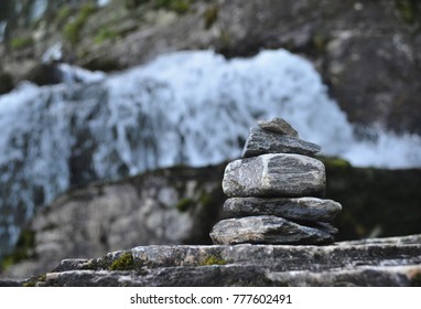 The stone stacked pyramid of desires is built on the stones of the waterfall of Twindeafessen, Norway.The symbol of faith in miracle and the fulfillment of desires. Balance, relax, calme