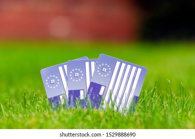 Stone, Staffordshire / UK - October 13 2019: Three European Health Insurance Cards On The Grass. The EHIC Card Covers You Against Illness Or Injury In Europe.