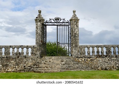 Stone staircase and wrought iron gate in the grounds of the Château de La Roche Courbon