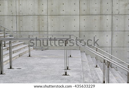 Stone stairs steps background with aluminium handle