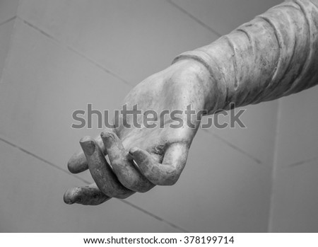 stone statue detail of human hand 