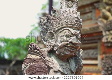 A stone statue of a Hindu god at Pura Tirta Empul, the Balinese Holy Water Temple near Tampaksiring — Ubud; Bali, Indonesia