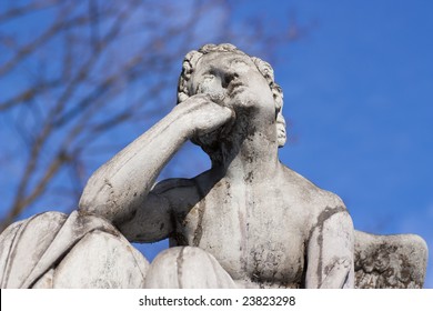 Stone statue, man deep in thought