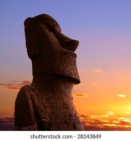 A Stone Statue On Easter Island At Sunset