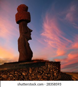 A Stone Statue On Easter Island At Sunset