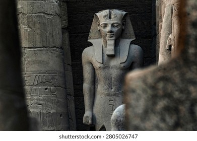 Stone statue of the Pharaoh Ramesses the second, at the ancient Niles side ruins of Luxor temple.Luxor, Egypt, Africa.