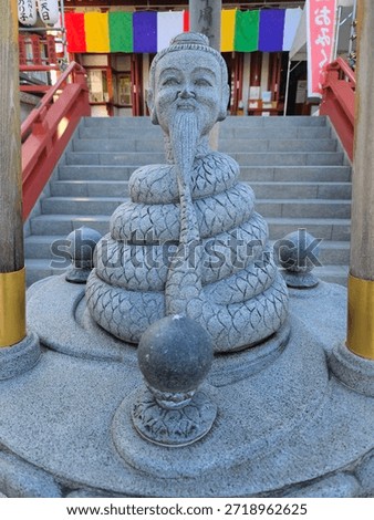 A stone statue from a temple inside Uno Park, Tokyo