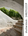 Stone steps under typical whitewashed archway in Casares, a  mountain village of Malaga province, Andalusia, Spain.