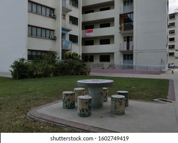 Stone stools and tables for residents to mingle - Shutterstock ID 1602749419