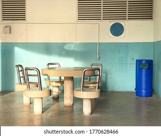 Stone stools and tables at void deck for residents to mingle - Shutterstock ID 1770628466