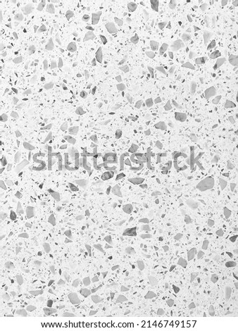Stone surface of floor or wall with small dots.