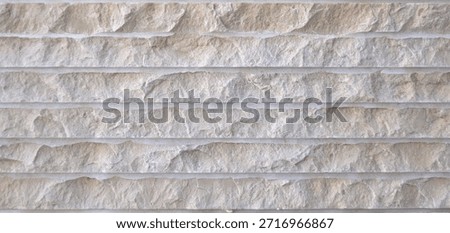 Stone surface texture of a quarry, pierced and broken by explosives, white stone