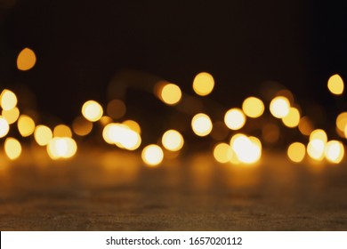 Stone Table And Festive Lights. Bokeh Effect