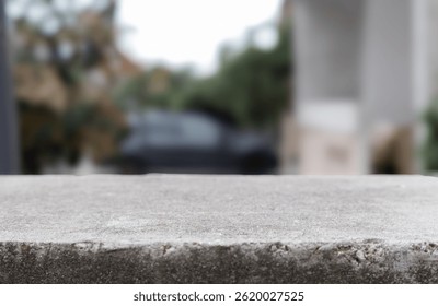 Stone table. Stone platform copy space with blurred background. Empty stone concrete grey table display template countertop for product placement and design. Luxury stone table podium