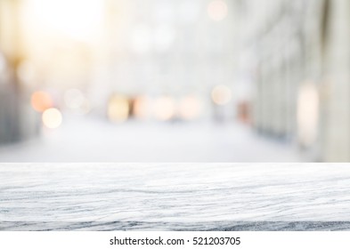 Stone table top and blurred shopping plaza background - can used for display or montage your products.