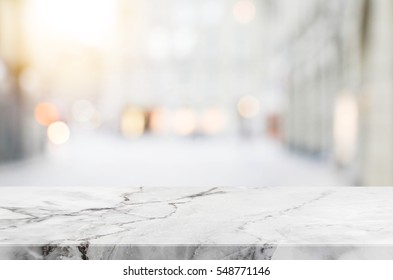 Stone table top and blurred shopping plaza background - can used for display or montage your products. - Shutterstock ID 548771146