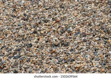 Stone Texture Background. Close-up Of Gravel Or Pepples Stones At Summer Beach With Selective Focus. Natural Design Backdrop For Your Project. Macro.