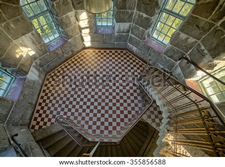 Stone tower interior with curved staircase, HDR image. This is a public building in Aulanko nature park in Finland.